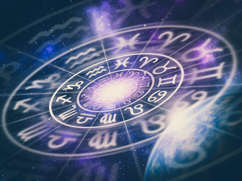 Astrological zodiac signs inside of horoscope circle on universe background - astrology and horoscopes concept