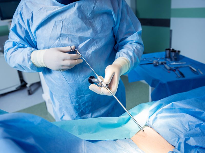 Surgeon Performs Endoscopic Microdiscectomy Of Herniated Interve Surgeon performs endoscopic microdiscectomy of herniated intervertebral disc.